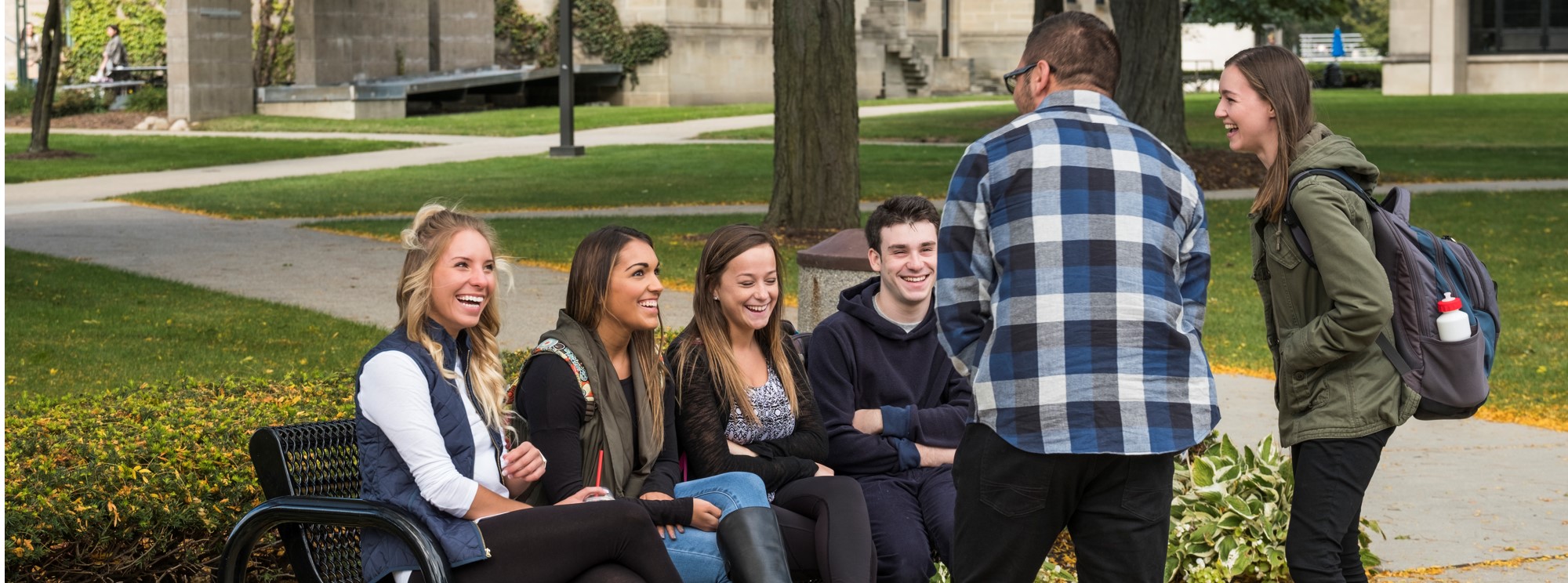Students on campus laughing