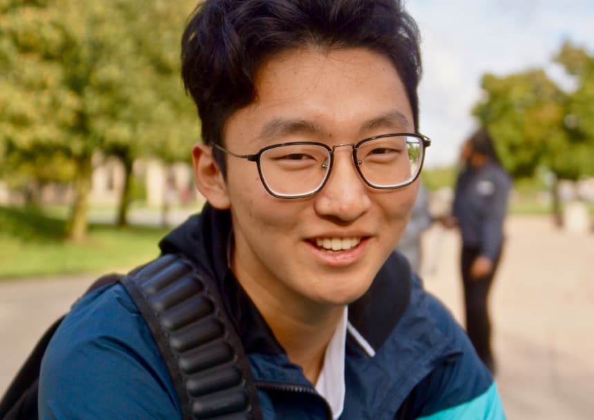 An international student smiles.