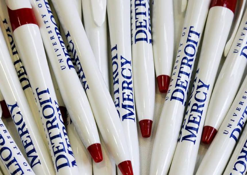 A pile of Detroit Mercy pens.