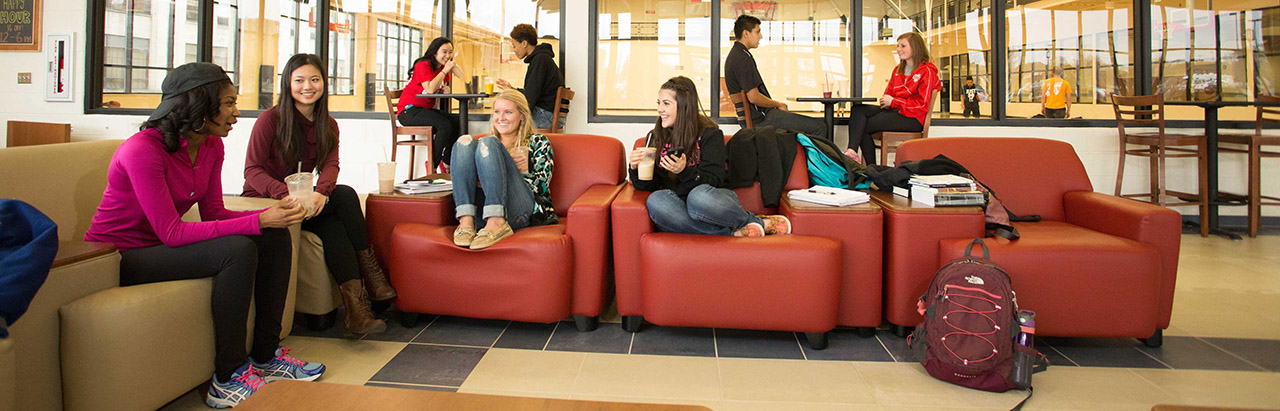 groups of students sitting at the fitness center, near tommy's