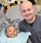 Dentistry student smiling with child