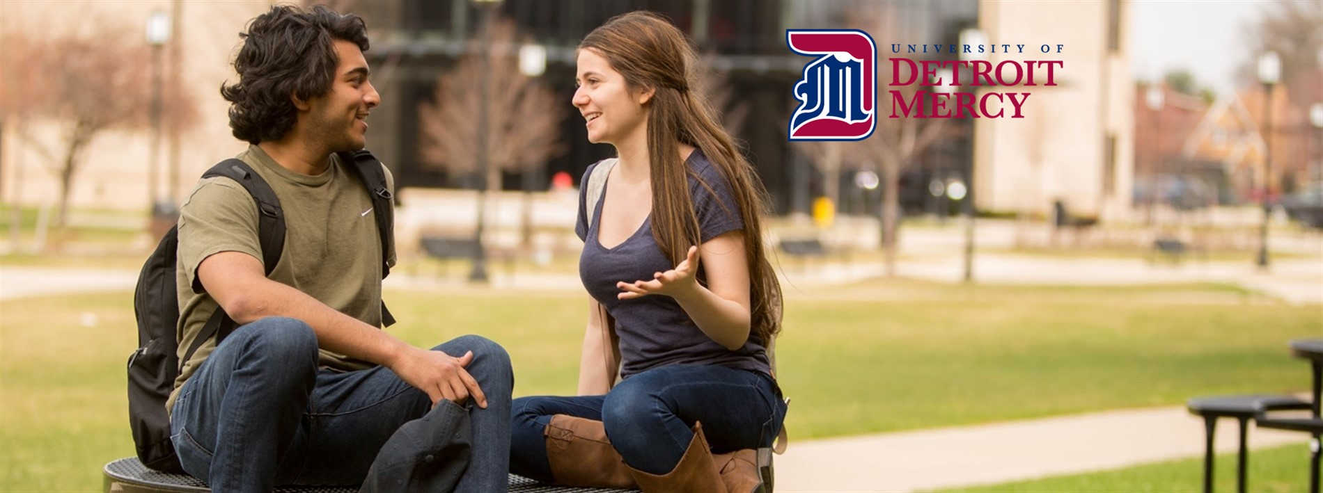 Students talk and smile on McNichols Campus.