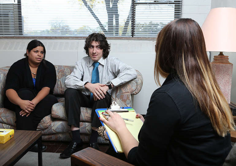 Three people in a clinic office