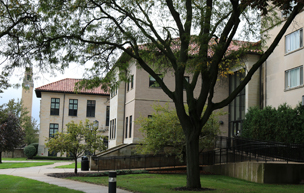 Picture of buildings on campus, including the College of Health Professions Building, and the clock tower.