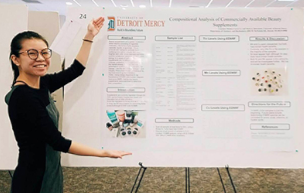 Coryn Le showcases a research project that she did during her studies at University of Detroit Mercy. The poster is on “Compositional Analysis of Commercially Available Beauty Supplements,” and it includes an abstract, introduction, methods, sample list, photos of the results and discussion, photos of the beauty supplies used and the Detroit Mercy logo.