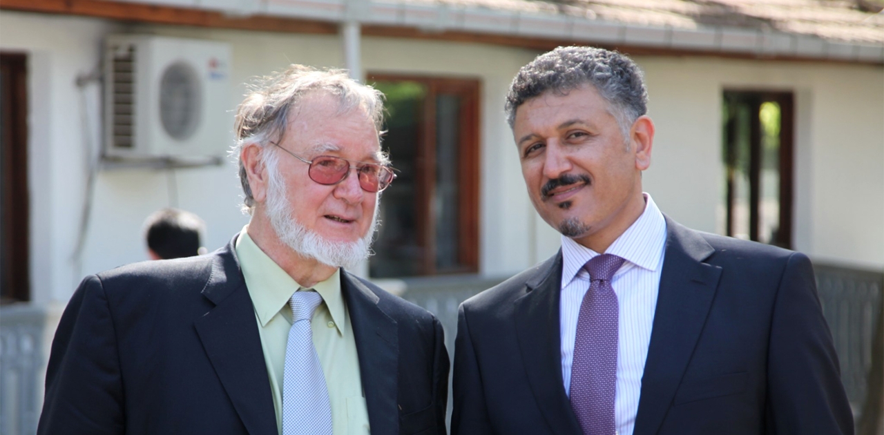 Nihad Dukhan, right, poses for a photograph with calligraphy master Mohamed Zakariya.