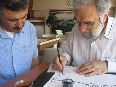 Nihad Dukhan watches closely during a lesson with master Hasan Celebi.