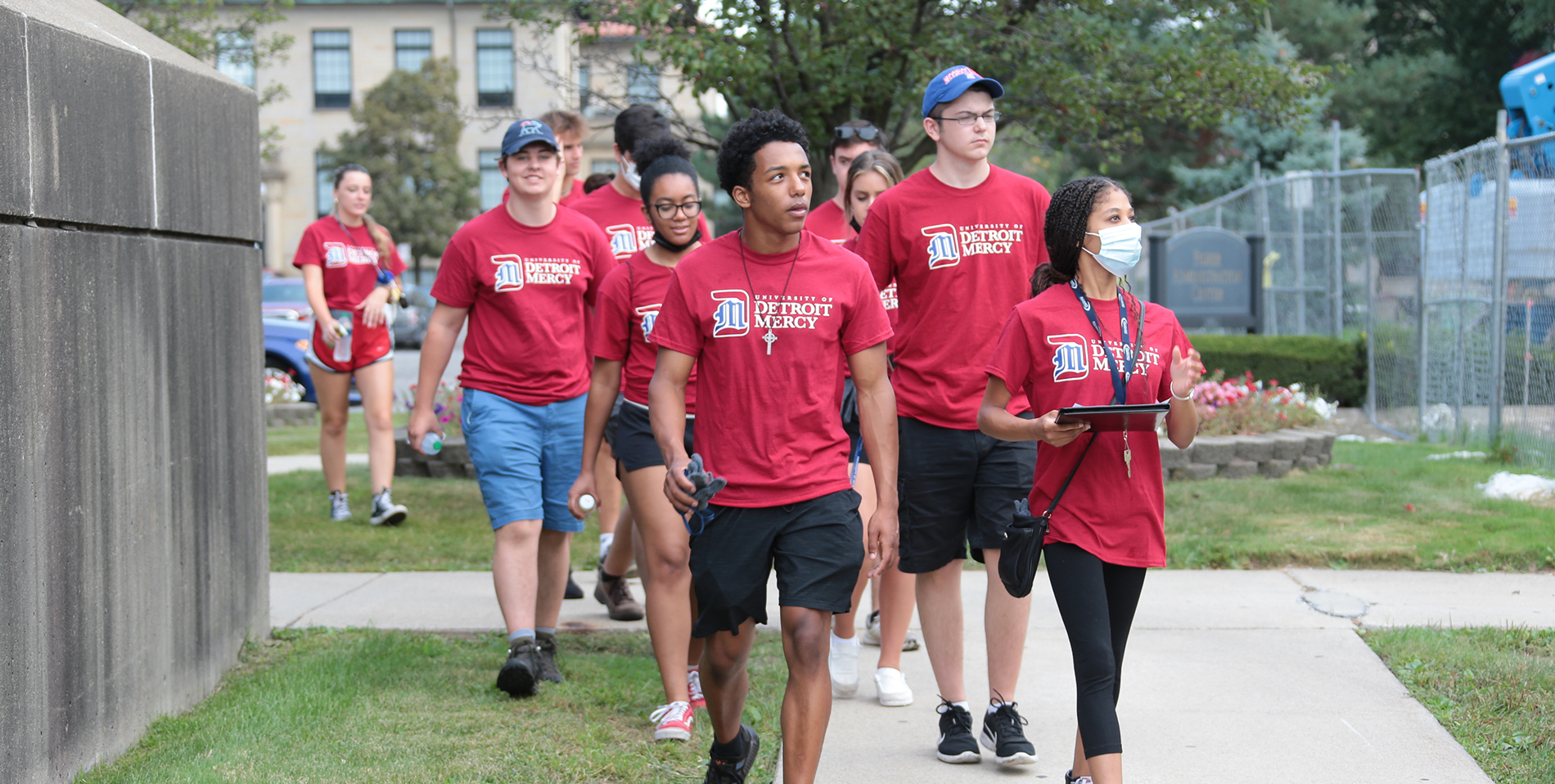 A group of Detroit Mercy freshmen walk together on the McNichols Campus.