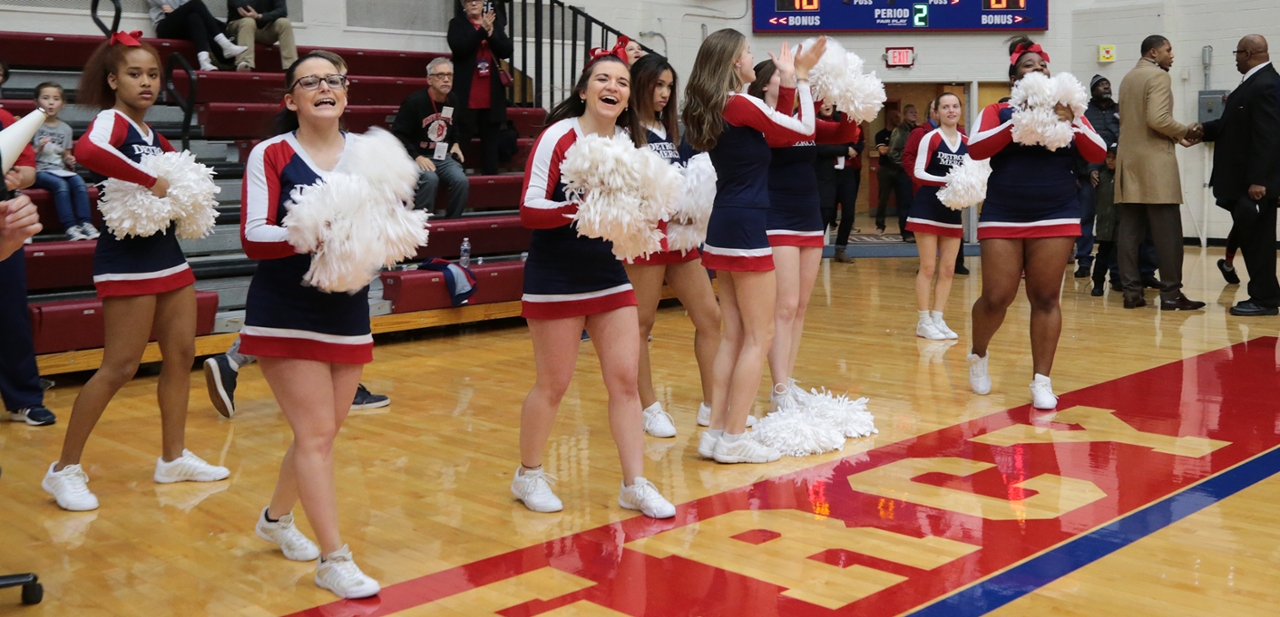 Taylor Kile cheers on the Detroit Mercy basketball teams as a member of the Titan cheerleading squad.