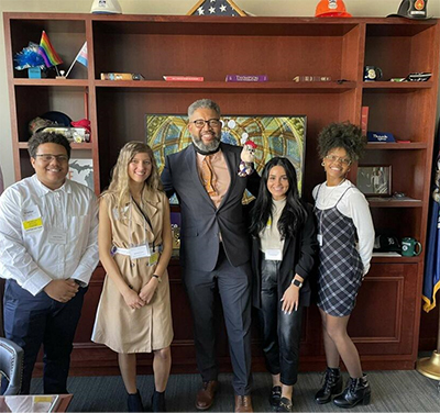 Detroit Mercy students Jaylin Brown, Natalia Grasso, Crystal Poota and Sonya Simmons stand with representative Marshall Bullock of District 4 in Detroit.