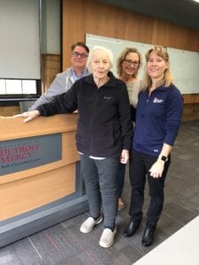 Tetreault, center, visited the University the year before her death accompanied by Alan Moore, left, and his wife, Rhonda, and met with Engineering & Science Dean Katherine Snyder, right.