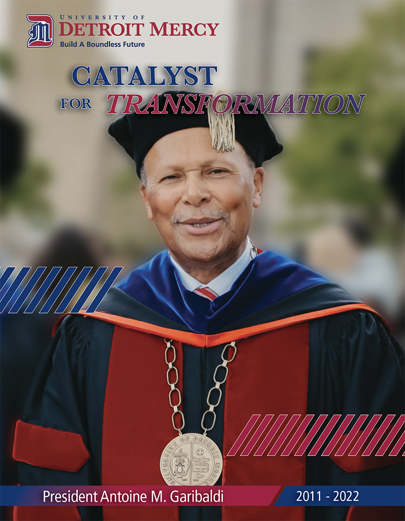 President Antoine Garibaldi stands smiling with his Commencement attire on. Text reads 'Catalyst for Transformation, President Antoine M. Garibaldi, 2011-2022.' University of Detroit Mercy, Build A Boundless Future logo is at the top.
