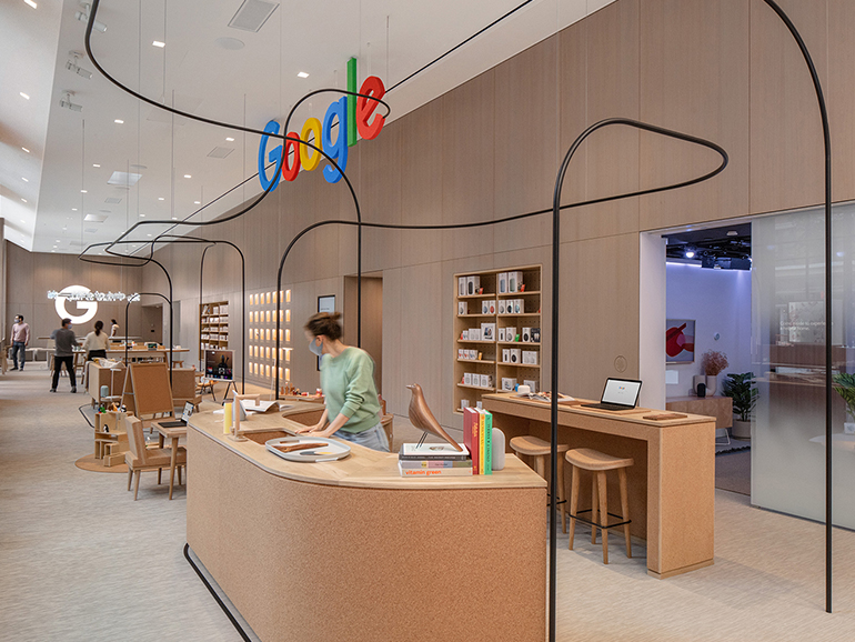 A photo of the inside of the Google store, with a few people pictured, in New York City.