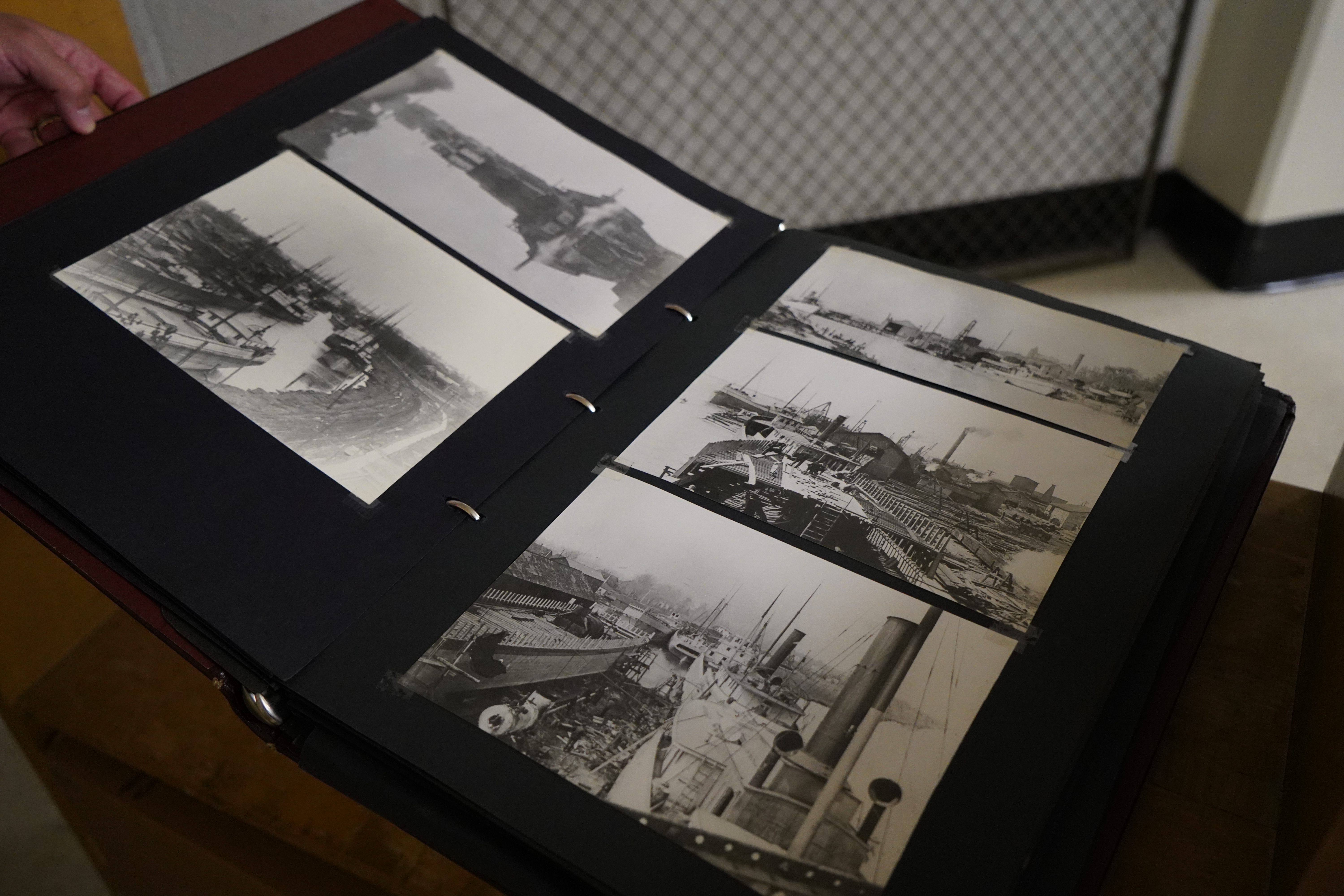 A binder showcases five black and white photos of Dowling's collection