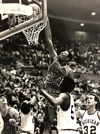 Earl Cureton jumps for a slam dunk during his playing days at University of Detroit.