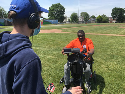 John Weglarz operates a video camera during an interview with former Detroit Tiger Ike Blessitt while working on a documentary about historic Hamtramck Stadium.