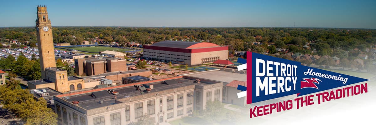 Detroit Mercy McNichols campus is seen from above with a small red, white and blue graphics that reads Detroit Mercy Homecoming Keep the Tradition