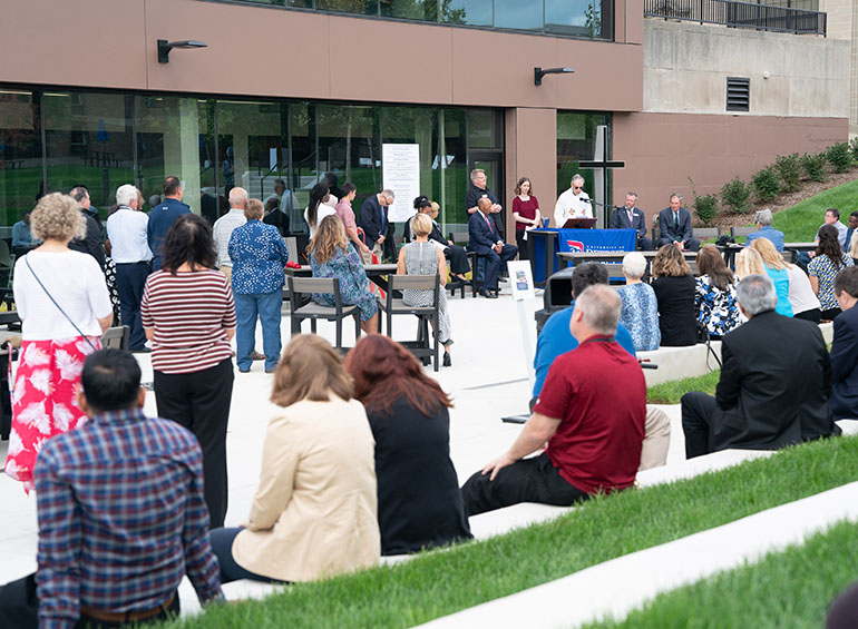 Members of the Detroit Mercy community watch and listen during the blessing of the new Student Union.