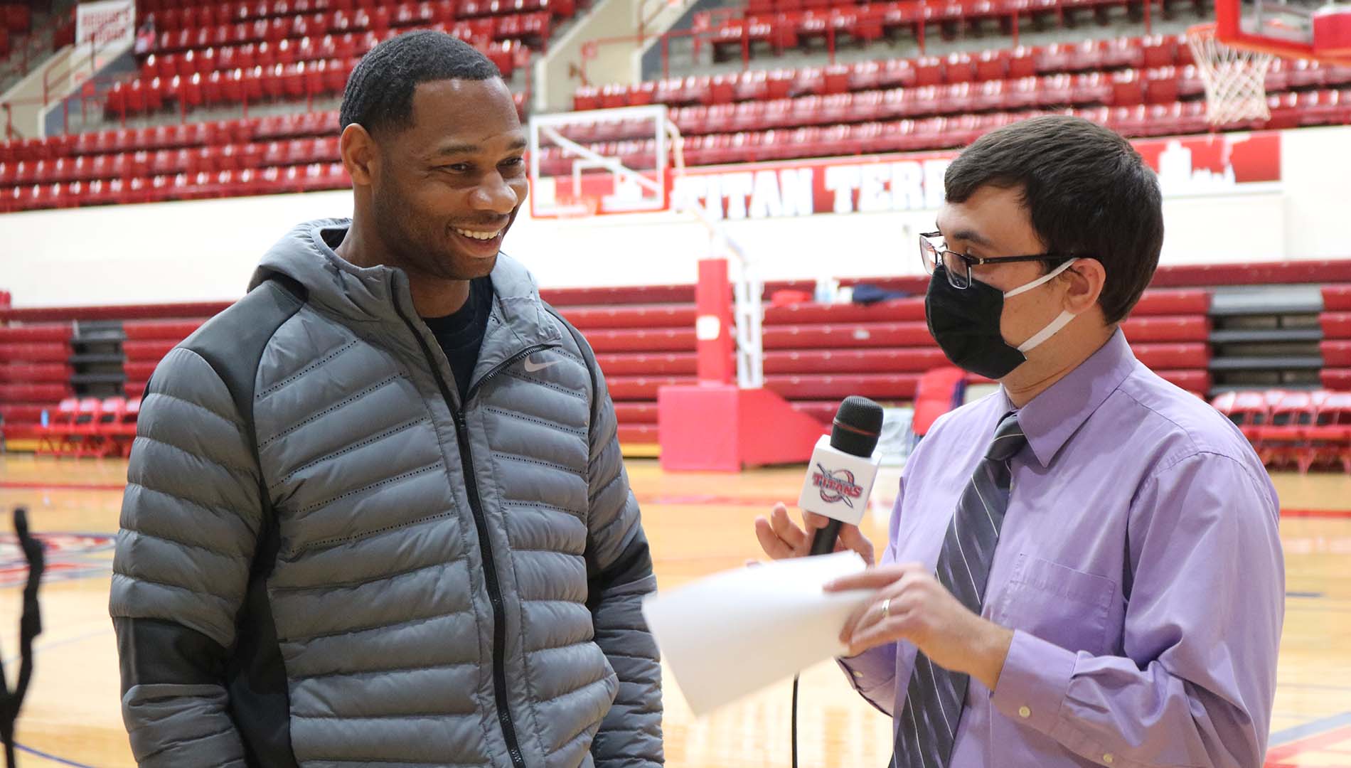 Willie Green '03 is interviewed by Detroit Mercy men's basketball commentator Jeremy Otto inside Calihan Hall before the Pelicans faced the Pistons.