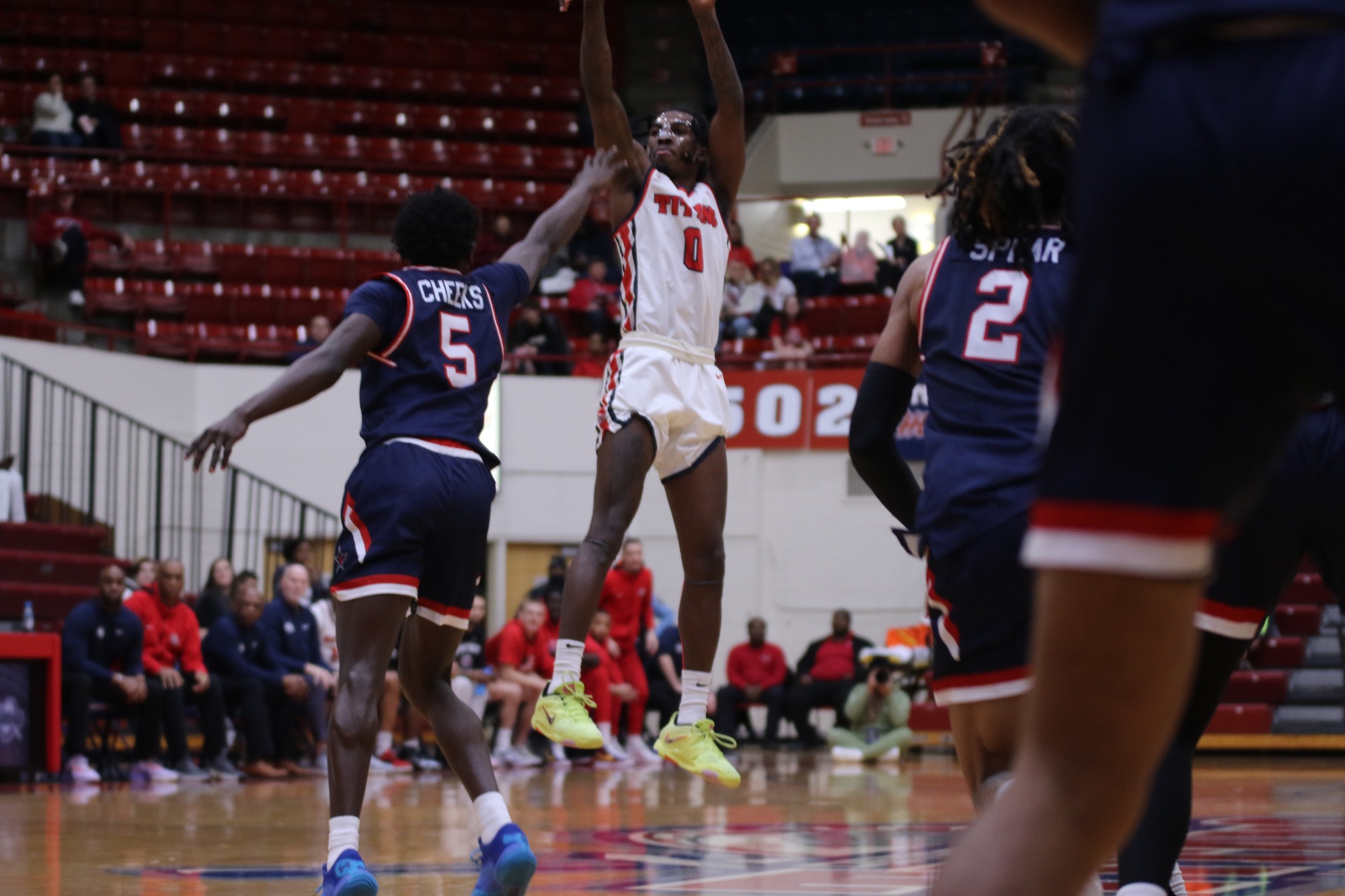 Antoine Davis shoots a 3-pointer inside of Calihan Hall with a pair of Robert Morris defenders looking on.