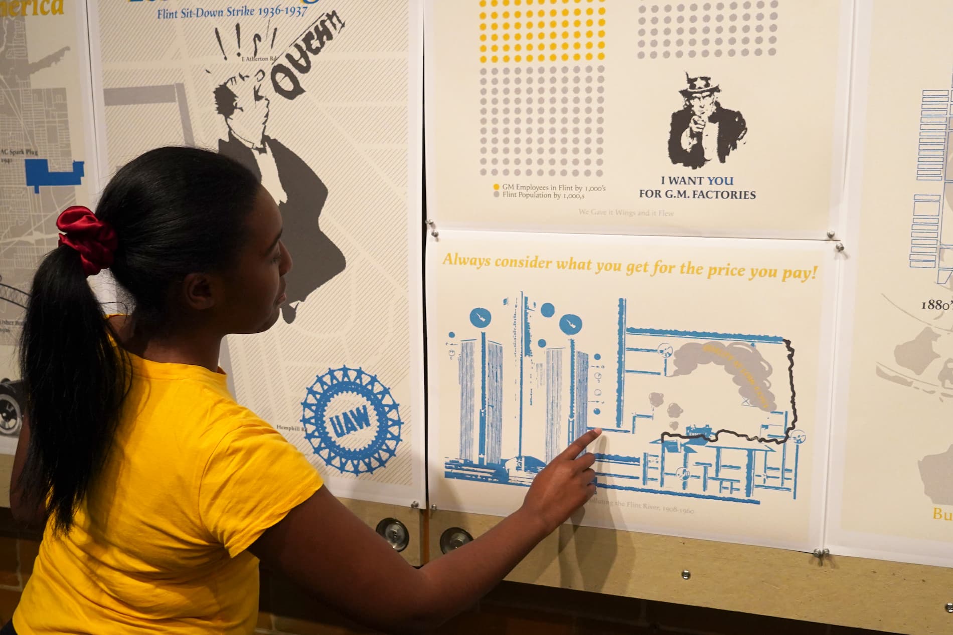 Angel Mangham points out one of her projects inside of the School of Architecture building.