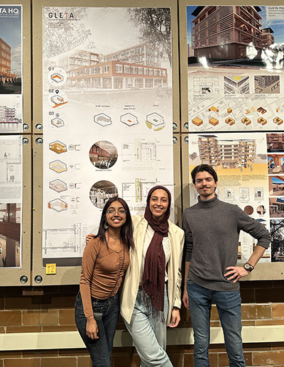 Dolin Diaz, Farah Ossaimee and Marcus Puste pose for a photo in front of their project, TIMBR.