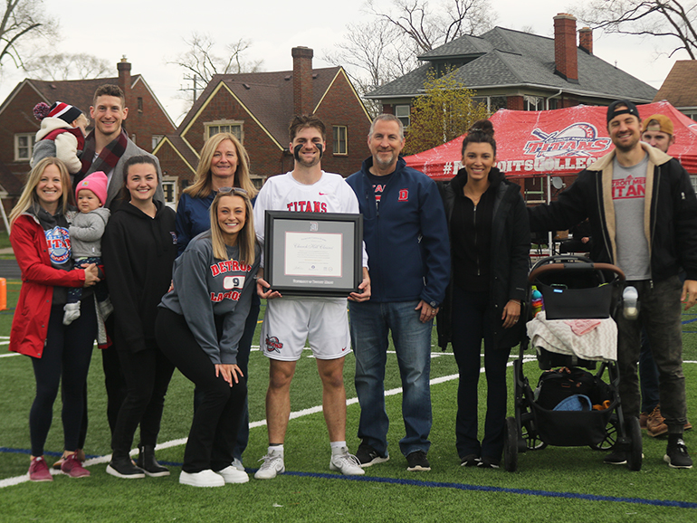 Birney family members stand on Titan Field for a photo at Ryan's senior day.