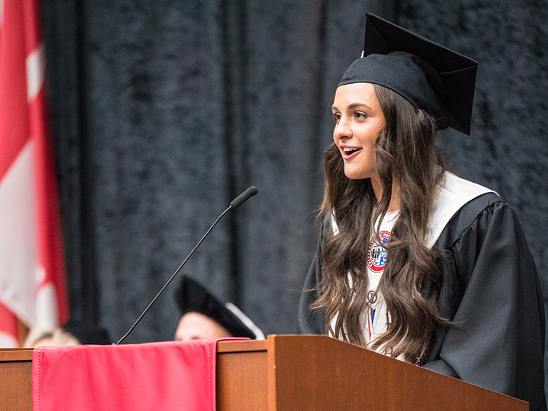 Kara Wolfbauer gives her valedictorian speech during commencement.