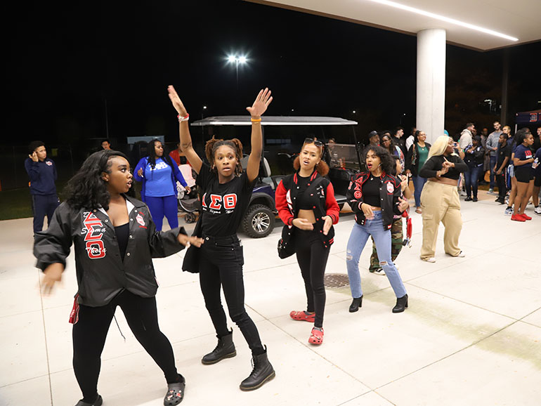 Students participate in a stroll off under the Student Union overhang during Homecoming.