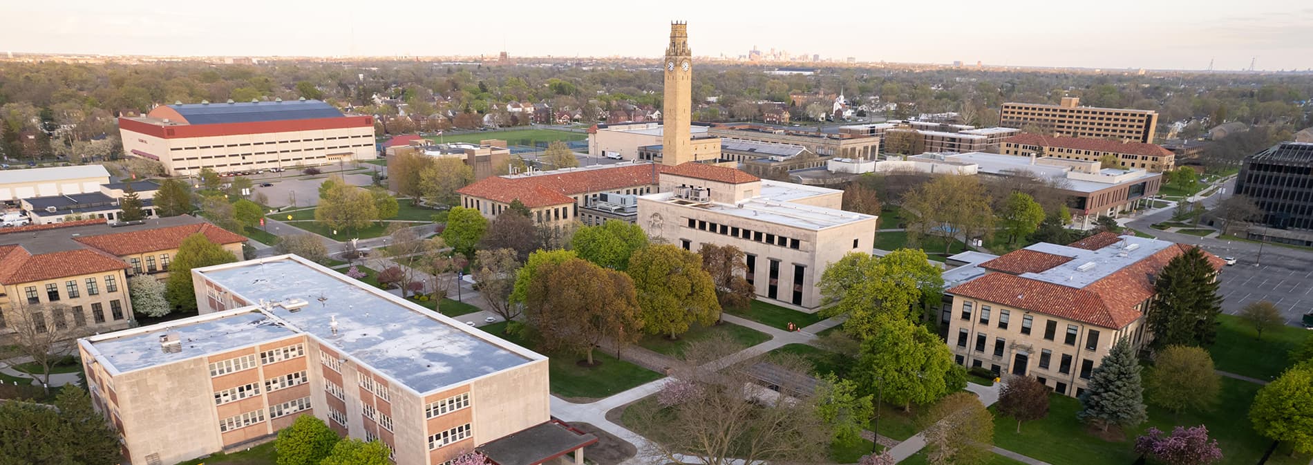 An aerial photograph of Detroit Mercy's McNichols Campus, featuring the city of Detroit skyline far off in the distance.