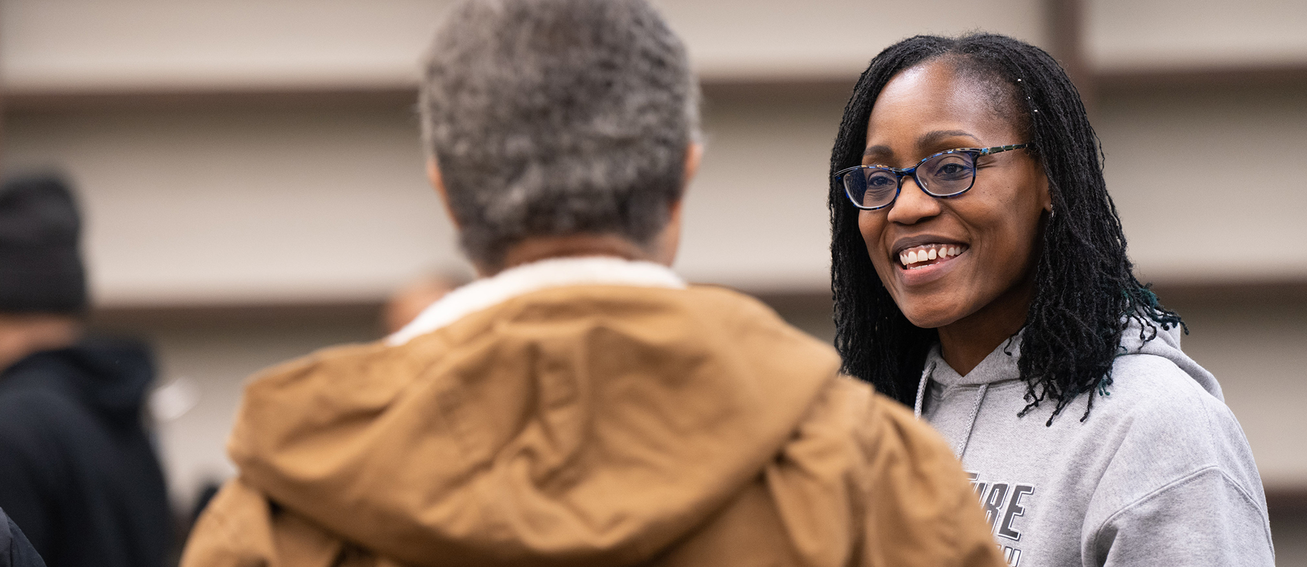 Shakesha Alexander '19 talks to someone at the Pup Culture Lab's grand opening.