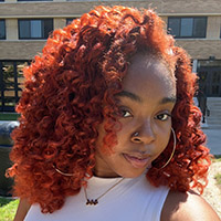 Anasia Staley takes a selfie outside of Shiple Hall.