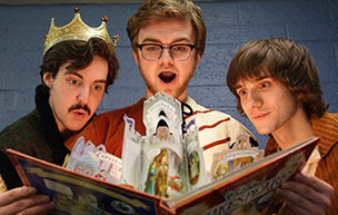 Three actors look into a book in a promo photo for The Complete Works of William Shakespeare.