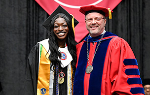 Kadyja Ka poses for a photo with President Donald B. Taylor