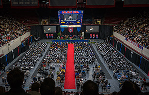 Overhead photo inside of Calihan Hall of 2025 Commencement, featuring hundreds of people sitting.