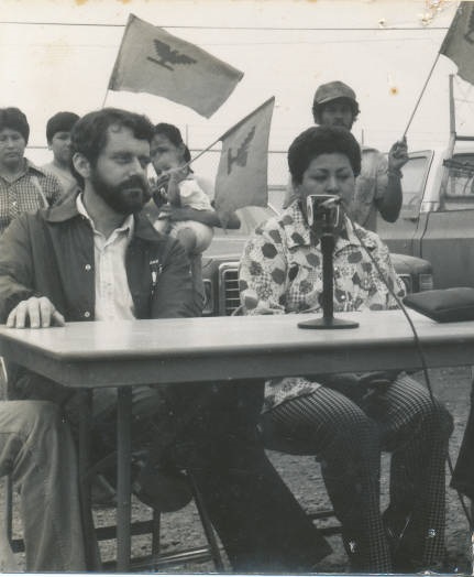 Harrington sits with a community member