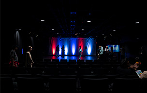 Students and faculty gather in the Black Box Theatre for a Performing Arts class.