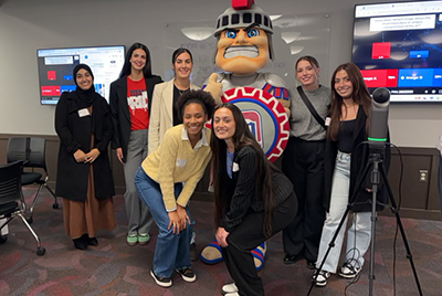 Courtney Christian with a group of classmates and Tommy Titan.