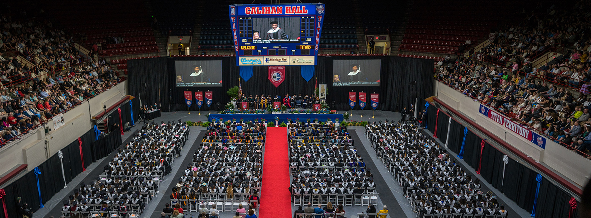 Overhead photo inside of Calihan Hall of 2025 Commencement, featuring hundreds of people sitting.