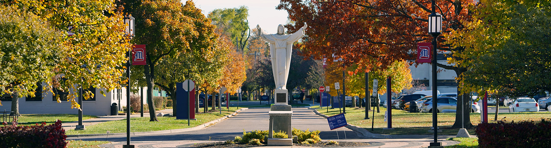 The Jesus statue on the McNichols Campus during fall.