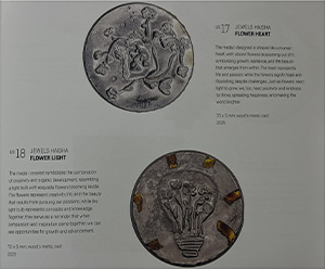 Photographs of Jewels Haisha's medals. There are two medals with the following text next to them. Flower heart: The medal I designed is shaped like a human heart, with vibrant flowers blossoming out of it, symbolizing growth, resilience and the beauty that emerges from within. The heart represents life and passion while the flowers signify hope and flourishing despite challenges. Just as flowers need light to grow, we too need positivity and kindness to thrive, spreading happiness and making the world brighter. Flower light: The medal I created symbolizes the combination of creativity and organic development, resembling a light bulb with exquisite flowers blooming inside. The flowers represent creativity, life and the beauty that results from pursuing our passions while the light bulb represents concepts and knowledge. Together they serve as a reminder that when compassion and inspiration come together, we can see opportunities for growth and advancement.