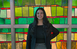 Cristal Guzman poses for a photo inside the Gardella Honors House.