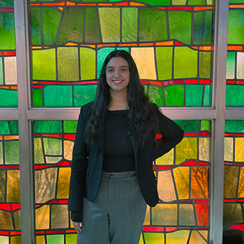 Cristal Guzman poses for a photo inside the Gardella Honors House.