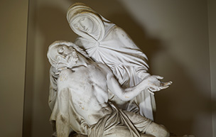 A statue depicting Mary holding Jesus’ body after his crucifixion sits at Detroit Mercy Law.