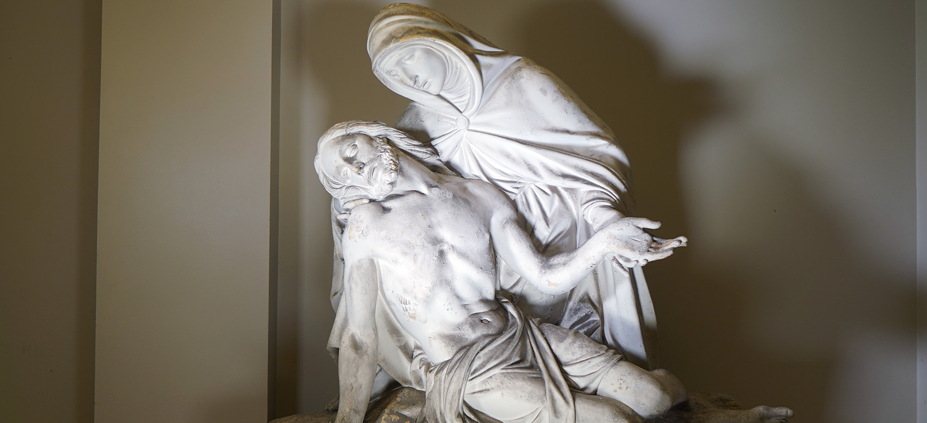 A statue depicting Mary holding Jesus’ body after his crucifixion sits at Detroit Mercy Law.