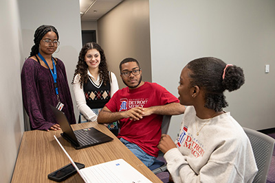 A group of students socialize in the Student Union.