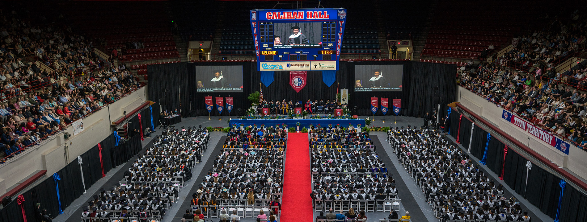 Hundreds of people inside of Calihan Hall during a Commencement ceremony.