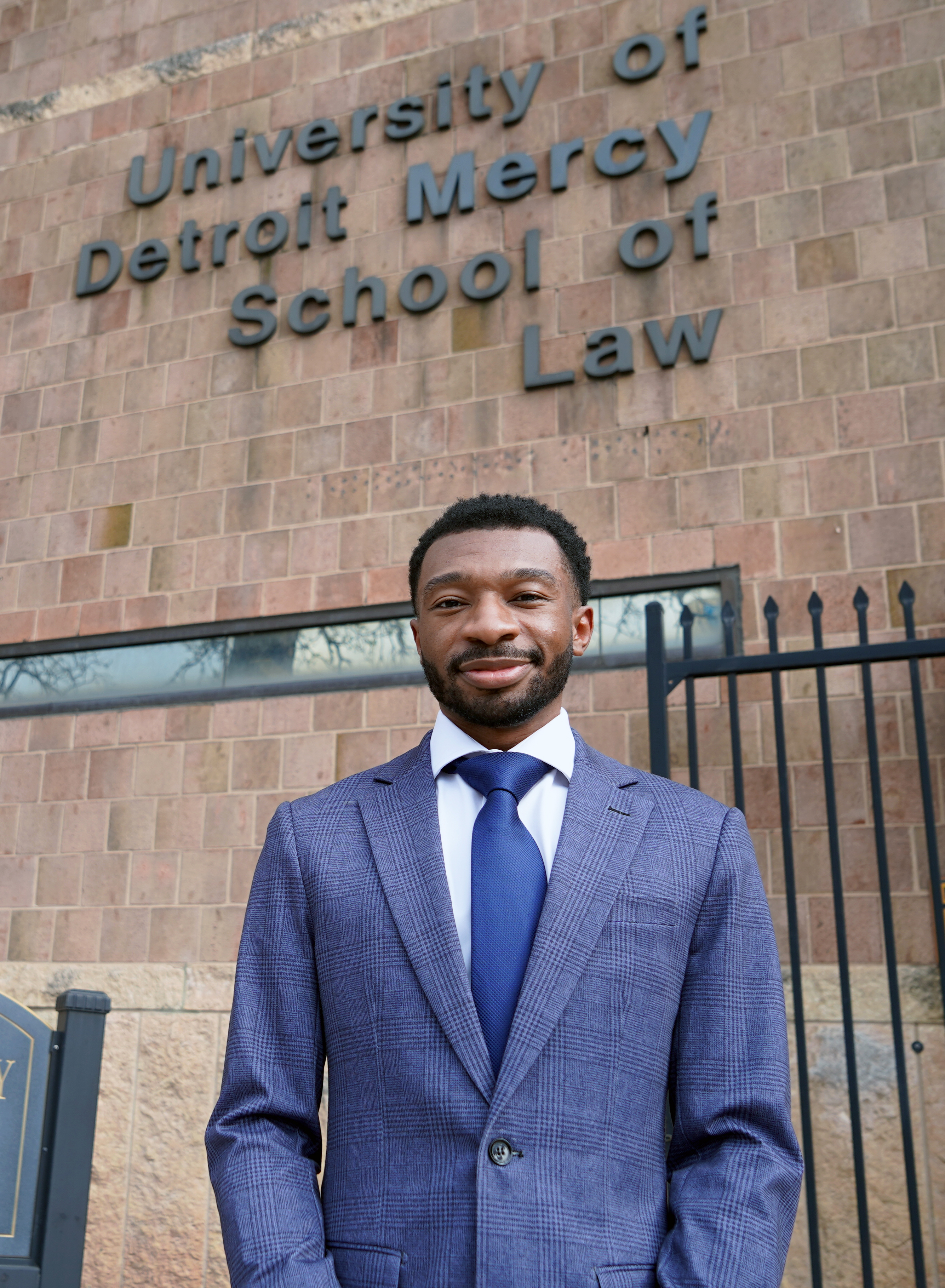 Andre Williams stands in front of the University of Detroit Mercy School of Law.