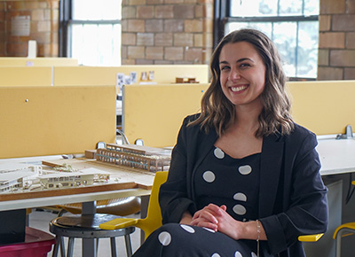 A photograph of Finley Booth in UDM's architecture studio.