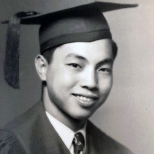 Don Yick Chin wearing his UD cap and gown.
